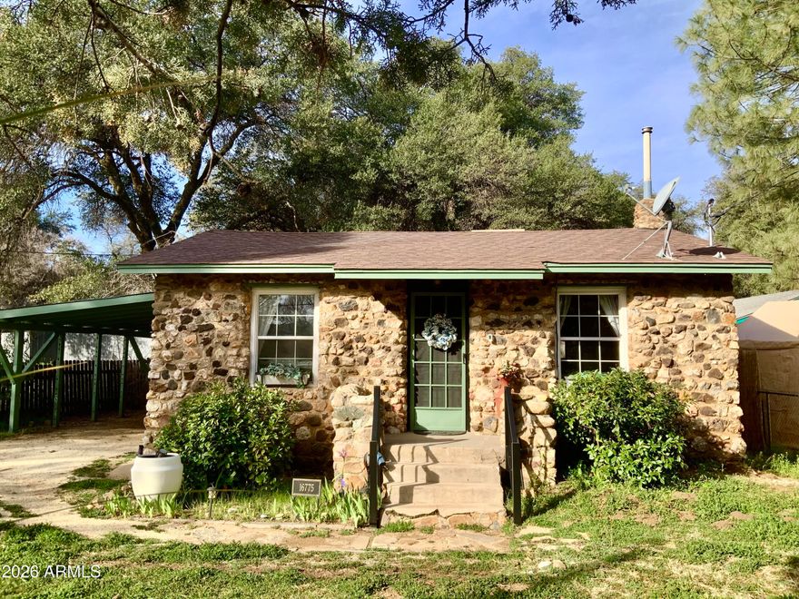 Historic & enchanting stone cottage, one of the original Yarnell rock homes built in 1934. Many updates: central HVAC, restored hardwood floors, tile countertops, interior & exterior paint, crown molding, all tile bathroom & many decorator finishes. European style kitchen w/view of backyard oasis. Crafted stone garden walls & ivy-covered oak trees create a sanctuary. New storage & perimeter fencing provides complete privacy & security for your pets. Property has been rented with Airbnb earning $1800+/m income.