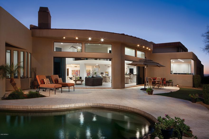 This 2020 updated and remodeled contemporary home sits on the 9th fairway of the Jack Nicklaus Signature golf course facing Pinnacle Peak with spectacular mountain and city light view. Walk distance to club house and driving range. The home is an entertainers dream and all on one level including Master bedroom except for a large, 2nd master suite with office upstairs. It includes 6 bedrooms, 6 full and 2 half baths, huge great room, formal dining room, theater/media/rec room, breakfast room, fabulous gourmet kitchen with center island breakfast bar  opening to the large Great room, 3 fireplaces, pool and spa, 4 car garage. Buyer to pay $75K DH membership fee at COE incl. Jack Nicklaus Golf, putting course 13 tennis courts, fitness center, clubhouse dining, Guard gated and security patrol