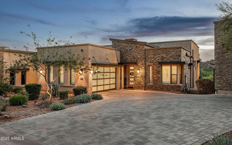 Experience luxury desert living in this exceptional 3 bed, 3.5 bath townhome located in the prestigious Overlook at Firerock community. This home's open-concept floor plan seamlessly connects indoor and outdoor living, featuring dramatic corner sliding glass doors that open to an expansive patio—perfect for entertaining or relaxing while taking in breathtaking views of the 18th hole at Firerock Country Club, surrounding mountains, and unforgettable sunsets. The main level offers a spacious primary suite with a luxurious bath and large walk-in closet, a hidden walk-in pantry, and a secondary bedroom with an en suite bath. The picturesque kitchen boasts high-end finishes, custom cabinetry, and elegant details throughout. Downstairs, the large living/game room with a wet bar and another set of sliding glass doors opens to a private spool (spa + pool) area overlooking the lush golf course. The lower level also features the third bedroom, the third bathroom, and a great "flex" room that could be used as an office or workout room, or even an additional bedroom (just without a window or closet). Additional highlights include two brand-new full HVAC systems (installed in 2025), premium materials and craftsmanship throughout, and thoughtful design that balances sophistication and comfort. This home truly has it allluxury, views, and an incredible location.