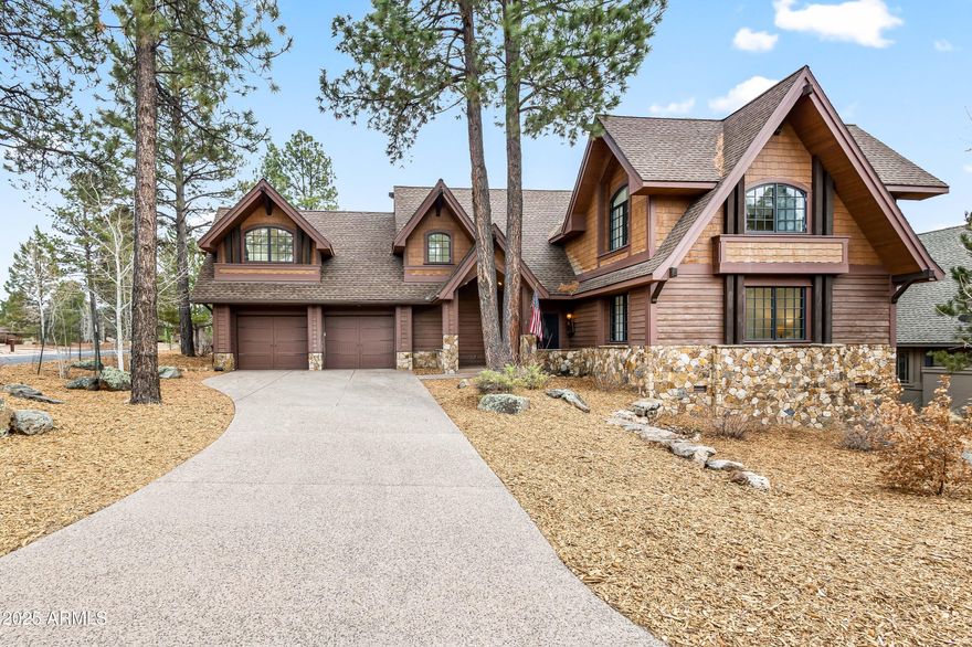 Discover mountain living at its finest in this beautifully crafted custom home nestled in the prestigious Pine Canyon community. Located on a quiet cul-de-sac, this home offers serene privacy and luxurious indoor-outdoor living in the heart of Flagstaff. Newly renovated, enter to soaring wood-beamed ceilings, expansive windows, and rich hardwood floors throughout. The open-concept great room is centered around a grand stone fireplace and flows seamlessly into the chef's kitchen, complete with high-end appliances, custom cabinetry, a large island, and a walk-in pantry. The spacious main-level primary suite offers a spa-like bathroom. Enjoy cool mountain evenings on the refinished expansive covered deck with built-in BBQ, gas fireplace, and tranquil forest. Additional features include brand new roof, and 2-car garage. Just minutes from downtown Flagstaff, hiking trails, parks, fishing, and Pine Canyon's world-class amenities including golf, fitness, dining, and more. Whether you're seeking a full-time residence, entertaining family, or a seasonal escape, this turnkey home blends rustic elegance with modern convenience.