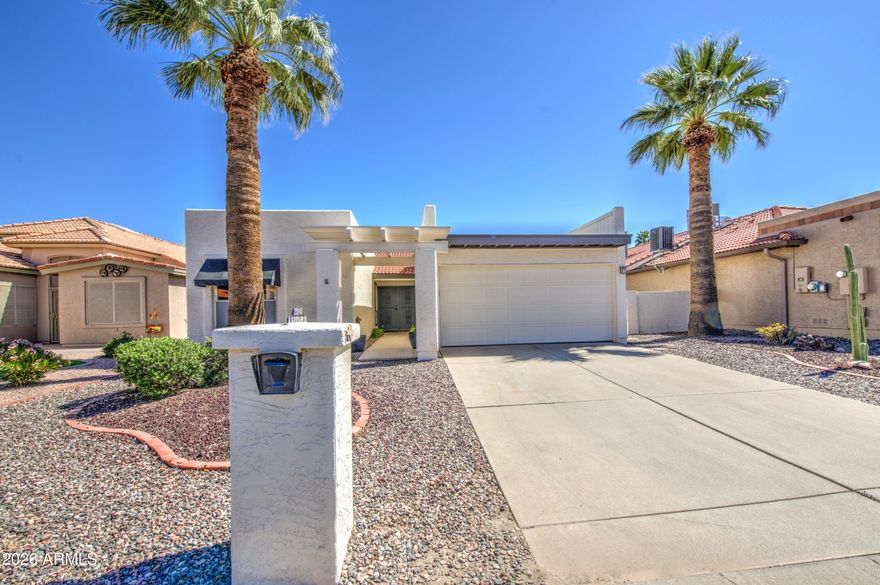 This beautiful Toltec model has tile flooring everywhere except the 2 ensuite bedrooms. Newer ceiling fans and lights, water heater in '25, featuring a full width screened-in rear patio. Pergola over the side patio and the front entrance. Epoxy coated garage floor with ample built in storage. This well maintained home is a great value at this price in Palo Verde. Enjoy the exclusivity and safety of this private, gated and guarded community of Palo Verde. Indulge in the Sun Lakes lifestyle with amenities including; clubhouses, restaurants, pro shops, 36 hole golf course, tennis courts, pickleball, bocce ball, racquetball, handball, heated swimming pools, jacuzzis, a state of the art fitness center.  Come take a look at this one.