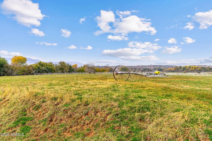 Build your dream home on this exceptional 2+ acre irrigated lot in the gated community of Rio Bonito Ranch. Ideally located across from the community pond, this premium homesite offers scenic views, privacy, and a peaceful setting. The irrigated acreage is perfect for pasture, a hobby farm, or horses. Property features include irrigation, a drilled well, house plans, geotechnical report, and septic permit—saving time and development costs. Enjoy paved roads, underground utilities, and private access to Oak Creek. Conveniently located near Sedona, Cottonwood, wineries, and outdoor recreation. A rare opportunity to own a ready-to-build parcel in one of Northern Arizona's most desirable communities.