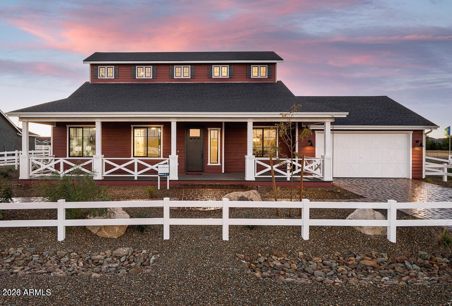 Welcome to one of the most upgraded homes in the community! This stunning former model home in Chino Valley showcases over $180,000 in premium builder upgrades and designer finishes throughout. From the moment you arrive, the farmhouse elevation, professional landscaping, black-framed windows, and luxury stone accents create unforgettable curb appeal. Inside, you'll find soaring 8-foot doors, upgraded wood-look flooring, custom cabinetry with soft-close features, quartz and designer countertops, matte black fixtures, two-tone paint, upgraded lighting, and a gourmet chef's kitchen complete with wall ovens, pot filler, under-cabinet lighting, and a dramatic 12-foot bi-fold glass door system that blends indoor and outdoor living beautifully. The spacious owner's suite offers a spa-inspired bath with freestanding soaking tub, oversized tiled shower with rain head, and custom barn door details. Enjoy cozy evenings with the linear gas fireplace and breathtaking Arizona sunsets from the extended patio. Located just minutes from shopping, dining, and outdoor recreation, with easy access to Prescott for historic downtown charm, lakes, hiking, and entertainment. Luxury, comfort, and model-home perfection all in one incredible property!