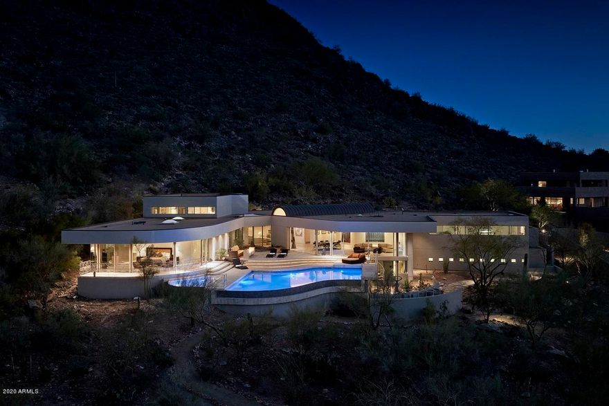 Magical views, light, tranquility and space...this home takes you a world away! Situated on northwest corner of Mummy Mountain. Lovely neighborhood and convenience close in. Windows all around highlight the beautiful mountain views. Relax in your infinity edge pool & spa while taking in the scenery.