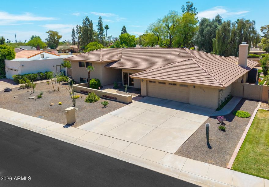 Spacious 6-bed/4-Bath home in desirable Round Valley Estates is extremely well maintained & move-in-ready! Walk in to find beautiful vaulted wood ceilings & 7-clerestory windows that flood the kitchen & dining w/natural light! Large kitchen features abundant cabinetry, ample counters, induction cooktop & Subzero fridge. The primary is just eight steps up while 3-additional split bedrooms are just 8-steps down w/their own bonus/game room & dedicated bath. Walk out back on over 14,000sqft lot to find a beautiful pool & grass backyard. Entertain on the expansive patio & take advantage of the pink grapefruit, lemon, & pomegranate trees. Notable upgrades include: owned 8kW solar (avg $102/mo electric bill) w/2,000W off-grid pwr, 2-new A/C units 2025, Wi Fi irrigation, & transferable Ring Alarm. This beautifully maintained home offers generous living space in the highly sought-after Round Valley Estates neighborhood. Perfect for families or multi-generational living, it features dedicated bedrooms, a guest wing, multiple home office options and a large 14,044 sqft / .32 acre lot!
Welcome guests through a magnificent custom iron entry door accented with translucent venting glass that makes the foyer bright with natural lighting and opens to allow cool-weather breezes inside. Your eyes are immediately drawn upward to the magnificent natural wood cathedral ceiling, where rich warm tones and soaring architecture create an unforgettable sense of openness and character. Seven clerestory windows line the upper walls, allowing soft natural sunlight to cascade throughout the dining room and kitchen. 
The heart of the home is a light-filled expansive chef's kitchen complete with extensive oak cabinetry, expansive counters, and an inviting open-concept design that anchors the main living spaces. The kitchen windows provide views of the entire pool, back patio, and grass area. Clerestory windows above not only flood the home with natural light, but also offer a rare opportunity to enjoy glowing views of the moon from the kitchen during certain times of the year. The flowing floor plan creates easy connectivity between the kitchen, dining, and living areas, while the downstairs layout provides excellent separation between the main living spaces and the dedicated bedrooms plus bonus/play room. Tucked away on its own private wing, the split-bedroom with a dedicated bath offers exceptional comfort and privacy, making it an ideal retreat for guests or extended family.
Step outside to an expansive 15 x 39 covered patio for exceptional year-round entertaining and relaxation. A professional high-pressure misting system helps keep the space cool and comfortable during warm Arizona summers. The resort-style backyard features a sparkling 25,000-gallon diving pool, lush real-grass play area, cozy fire pit, and RV gate access. Low-maintenance desert landscaping in the front pairs beautifully with the backyard's mature fruit trees, including sweet pink grapefruit, lemon, and two productive pomegranate trees, creating a private outdoor retreat.
Additional highlights and upgrades include:
" 8kW Solar System (fully paid for) with transferable SRP grandfathered metered billing through February 2032 (average electric bill just $102/month over the last year)
" New solar inverter (2023) that provides 2,000W solar backup power when sun is shining
" New interior paint (2026)
" New - Both Air Conditioners replaced with 10-year warranties (2025)
" New - Pool Deck paint, bonder and Slip Safe additive w/ 2 yr warranty (2025)
" New GE Café induction cooktop (2024)
" New Tankless water heater (2024) at the kitchen sink for instant hot water
" New front desert landscaping and lighting (2024)
" New Front security/screen door with ventilated door and side windows (2022)
" WiFi-enabled irrigation system (2022) controlled by a phone app
" Transferable Ring Alarm (2020) system with sensors on all downstairs doors/windows, and 3 cameras
" Upgraded Whirlpool Smart Oven (2018). 
" Updated Decora light switches and outlets throughout (2018)
" Quiet, family-friendly street with low traffic
" Alley provides RV gate access, additional home separation for privacy, and convenient bulk trash pickup  
Located in South Tempe with easy access to freeways, with Sky Harbor airport less than 15 minutes away, and several great options for shopping and restaurants less than 1 mile away.  This home offers the perfect blend of space, comfort, convenience and modern living.
