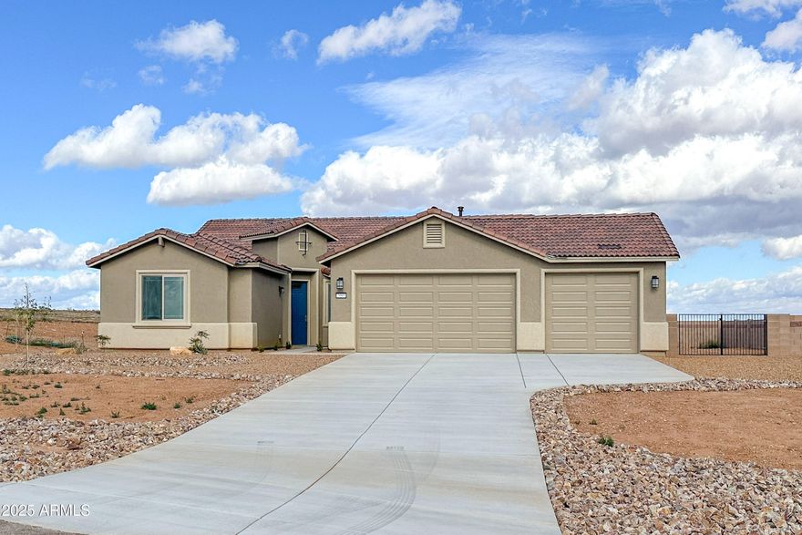 New Construction Home in King's Ranch! This stunning 4-bed, 2-bath home offers 2,116 sq. ft. of modern living on a 2.48 acre lot. The 3-car garage provides ample storage, while inside, you'll find 6x24 wood look tile floors, two-tone cabinets, light quartz countertops, subway style backsplash and stainless steel appliances. The primary suite features a bay window with valley views, a custom walk-in shower with niche, and a spacious walk-in closet. Front landscaping with irrigation timer, block rear yard enclosure and 10' gate for easy access also adding to the curb appeal. Energy Saving Environments for Living Certified, this home offers comfort, efficiency, and peace of mind with all the new construction warranties.