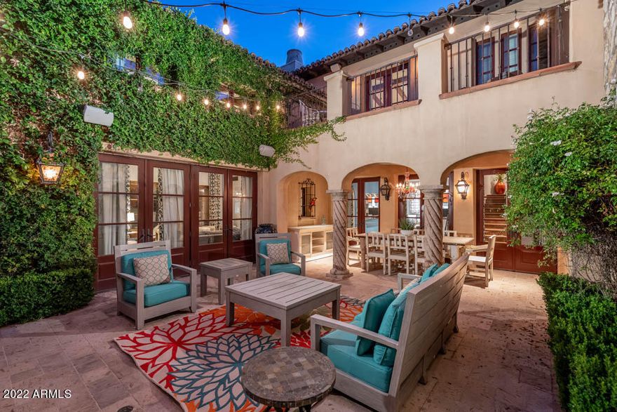 Located in the coveted Omni Montelucia Resort & Spa Villas, this 4,550 sf European style house boasts beautiful Camelback Mt. views. 3 bedroom/3.5 bath home w/separate casita is situated on the largest lot in the community. The interior is open for today's living while maintaining intimacy + charm w/beautiful hardwood flooring, high ceilings w/ floor to ceiling glass French doors framing Camelback Mt. The chef's kitchen includes Viking appliances, plus a large Butler's Pantry. The intimate master suite w/vaulted ceilings, spa bathroom, 2 terraces w/mt. views & large den complete the private upstairs. Outdoor entertaining at it's finest includes an outdoor kitchen, gazebo, fountain & mt. views. Enjoy concierge services, room service, spa, fitness center, gourmet restaurants & 3 resort pools Some furniture to convey with property.