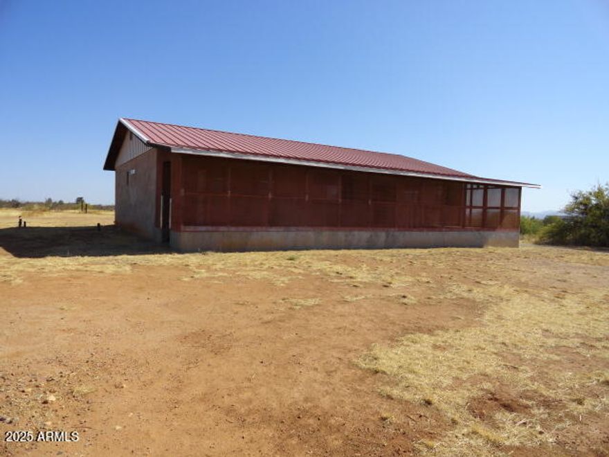 The home site on a fenced property with great views and very usable land.  You will love the wonderful shop with power and a concrete floor. The home has a fantastic enclosed front patio that is elevates so you can watch the monsoon rains roll in from the south as well as the amazing mountain and valley views. There is a large great room and a wide galley kitchen and huge walk in pantry. The storage in this home is almost endless. The lovely master suite is on the east end of the home and also has a large walk in closet. The secondary bedrooms are on the west side of the home and have a good sized bath on that side. Head downstairs to the laundry room and 1/2 bath.