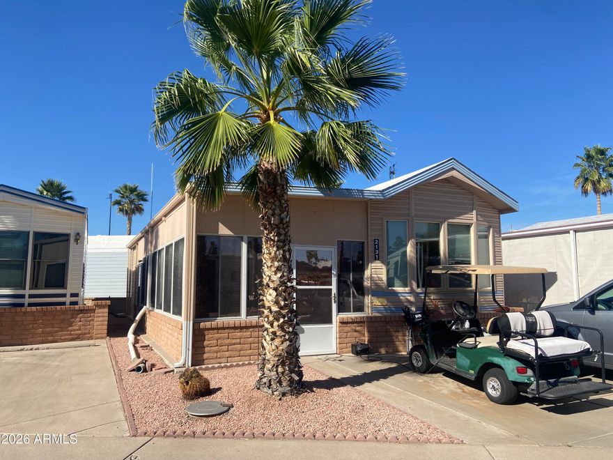 Nicely updated with spacious Arizona room with walk in laundry and storage. Great floor plan, new blinds, solid surface flooring throughout! On a quiet street in the best 55+ golf course community in the east valley! Enjoy the on-site restaurant, therapy pool, lap pool and large community pool with multiple hot tubs, new exercise room, tennis, pickleball, bocce ball, billiards and the list goes on...and on! Dog friendly 55+. Free park tours on request.