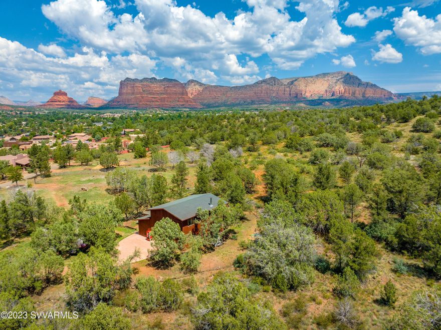 Possibilities are endless! This gorgeous 2.53-acre lot is adjacent to the National Forest Service offering breathtaking views of the Red Rocks. Horses Allowed. Verify with county possible lot splits and uses/restrictions for existing building.  No HOA.  Short term rentals possible. Buyer to verify. The land provides direct access to extensive horseback riding and walking trails that span for miles. This is a rare find!  Possible Owner Carry!