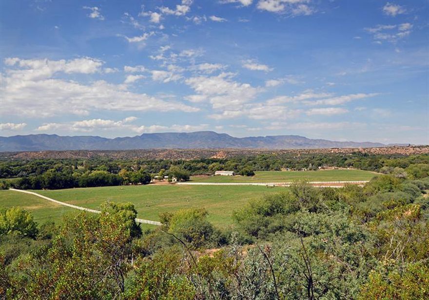 Set on the banks of Oak Creek in a picture-perfect setting, this is the most beautiful 70-acre ranch in the Verde Valley, pristinely maintained & w/huge, abundant water rights for any use. Known as the ''Emerald of Cornville, Arizona,'' Tres Hermanas Ranch comes w/56 irrigated acres of adjudicated water rights dating back to 1898 from the Mason Lane Water Assoc., a warm & terrifically maintained split level light-and-bright redwood 4-BR ranch house beautiful updated w/a new kitchen in 2012, the wonderful original hardwood floors, Pella windows, truly stunning views of the pastures all the way down to Oak Creek, ponds, waterfalls, an 8 stall center-aisle MD barn w/turnouts, pipe corrals w/shades, a large hay barn w/shop, a 20,000 gallon water tank, all ... (see supplement for full remar Set on the banks of Oak Creek in a picture-perfect setting, this is the most beautiful 70-acre ranch in the Verde Valley, pristinely maintained & w/huge, abundant water rights for any use. Known as the ''Emerald of Cornville, Arizona,'' Tres Hermanas Ranch comes w/56 irrigated acres of adjudicated water rights dating back to 1898 from the Mason Lane Water Assoc., a warm & terrifically maintained split level light-and-bright redwood 4-BR ranch house beautiful updated w/a new kitchen in 2012, the wonderful original hardwood floors, Pella windows, truly stunning views of the pastures all the way down to Oak Creek, ponds, waterfalls, an 8 stall center-aisle MD barn w/turnouts, pipe corrals w/shades, a large hay barn w/shop, a 20,000 gallon water tank, all irrigation equipment for the pastures, perimeter white vinyl electric cross fencing & much more. This is a breathtaking property, rimmed by mature Cottonwood & Sycamore trees along Oak Creek, & open to the gorgeous sunshine year-round