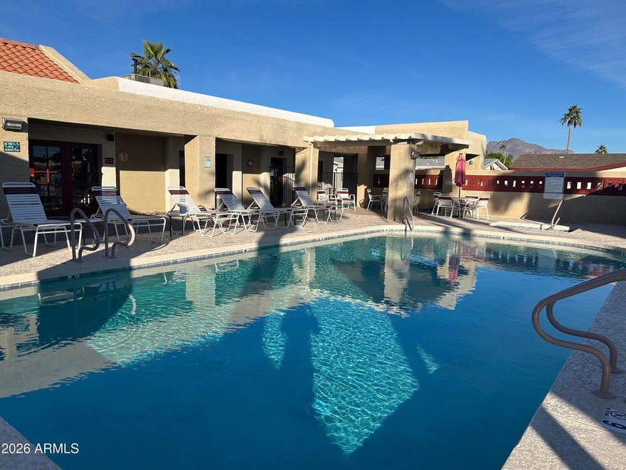 Enjoy the sunshine and a carefree life in this gated 55+ community. Many, tastefully done upgrades to this unit in 2023! This ground set unit has elegant cement work and landing allowing easy access. It offers a bright and airy open plan. The kitchen has a butcher block island with ample storage; dining is just off the kitchen with open access to the living room. All appliances are included. There is attractive laminate and vinyl flooring throughout. The master is large and provides closet organizers, dual sinks, and a walk-in shower in the master bath. It has a handy utility area that includes the washer and dryer. Savor out/door living in the screened in AZ room. Exterior is repainted with a modern pallet for an attractive curb appeal. The yard is fenced to keep your animals safe and has a handy, large BONUS storage shed. The main shed is attached to be used for hobbies, or more storage. You are invited to take part in community indoor events at the clubhouse (meals, game nights, etc) or outdoor activities at pool side, bocce ball and shuffleboard. The open desert is just minutes away with ample hiking trails for all fitness levels.  This unit has it all; so, take a look at it today!