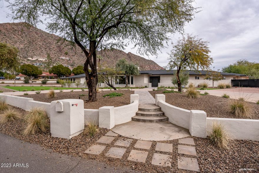 This sprawling single story newly remodeled family estate sits on a flat 42,149 square foot view lot on Royal View Drive, one of the most desirable streets in Arcadia/Camelback Mountain. It offers over 5,000 square feet of living space, a open floorplan, 5 bedrooms, two offices, 5 bathrooms, a 2 car garage and a second detached two car garage that has been converted into a guest quarters without permits. The property has an amazing backyard with a pool and stunning Camelback Mountain views.