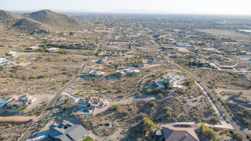 Perched atop a hillside in one of Northwest Peoria's most sought-after areas, this 1.147-acre lot delivers the kind of unobstructed Sonoran Desert and mountain views that custom home buyers spend years searching for. The elevated position captures sweeping sight lines across the untouched desert landscape a perfect canvas for an custom estate framed by the scenery.
City tap water access available via the 92nd Ave easement, providing a reliable municipal supply without the complexity of on-site well. The property location is minutes from shops, dining, and entertainment clustered around Lake Pleasant Pkwy and Happy Valley while the hillside setting keeps the lot itself quiet and removed.
For buyers seeking a custom home site where panoramic desert views verified utilities, and proximity to one of the Phoenix metro's fastest-growing communities come standard -- this is a rare find.