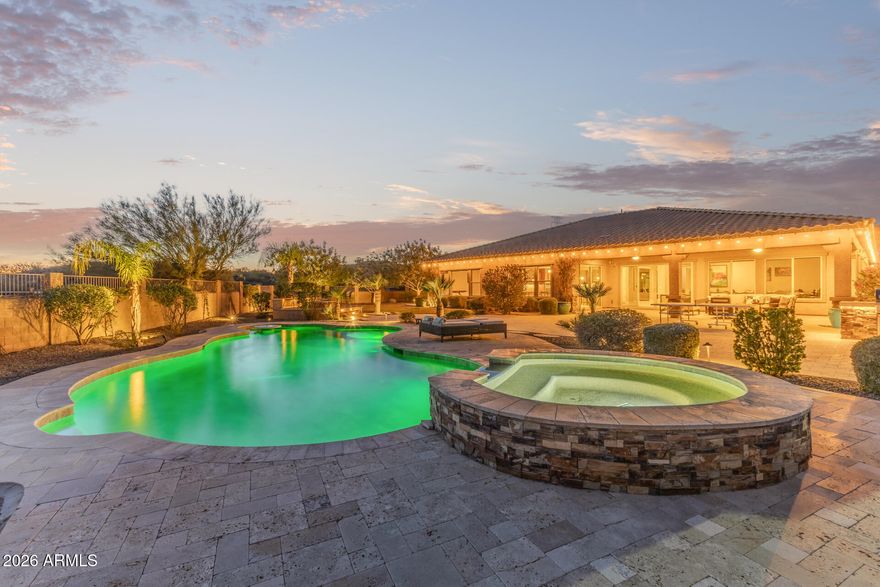 HUGE PRICE REDUCTION-MUST SEE!!! Beautiful acre lot. Located within a gated cul-de-sac on just over an acre, this exceptional Peoria estate offers refined luxury, privacy, and resort-style living. The thoughtfully designed main residence features 4 bedrooms, 4 bathrooms, elegant tile flooring throughout, and a private casita, ideal for guests, multigenerational living, or a home office.

The chef's kitchen is a true centerpiece, showcasing a Wolf gas range, Sub-Zero refrigerator, generous prep space, and a butler's pantry complete with a wine and beverage refrigerator perfect for entertaining. Expansive living areas open seamlessly to the outdoors, where a private resort-style setting awaits. The backyard features a heated pool and spa, a full sport court, and sprawling grounds that offer both privacy and versatility perfect for entertaining, recreation, or simply enjoying Arizona's outdoor lifestyle.

Car enthusiasts and adventurers alike will appreciate the 3-car garage, two RV gates, and ample space to add an RV garage or additional structures. Situated on a premium oversized lot within a gated HOA community, this property combines luxury, functionality, and exceptional outdoor living in one remarkable setting.
