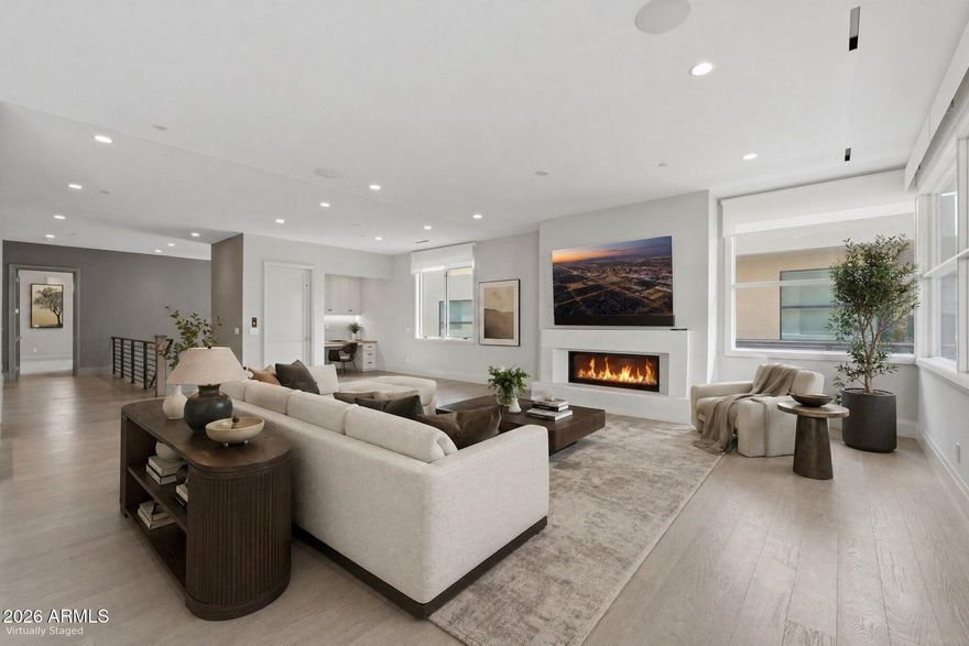 Set within the iconic Mountain Shadows Resort in Paradise Valley, this 3,620 sq ft residence embodies effortless resort-style living in one of Arizona's most coveted locations. Surrounded by the natural beauty of Camelback Mountain and moments from scenic hiking trails, the home also offers convenient access to premier shopping and dining. All living spaces are thoughtfully arranged on a single level, reached by private elevator or stairs, creating a seamless and sophisticated arrival. Expansive sliding doors open to a covered terrace with fireplace, blending indoor and outdoor living against a dramatic mountain backdrop. Designed for both comfort and entertaining, with access to exceptional resort amenities, this is desert living at its finest.