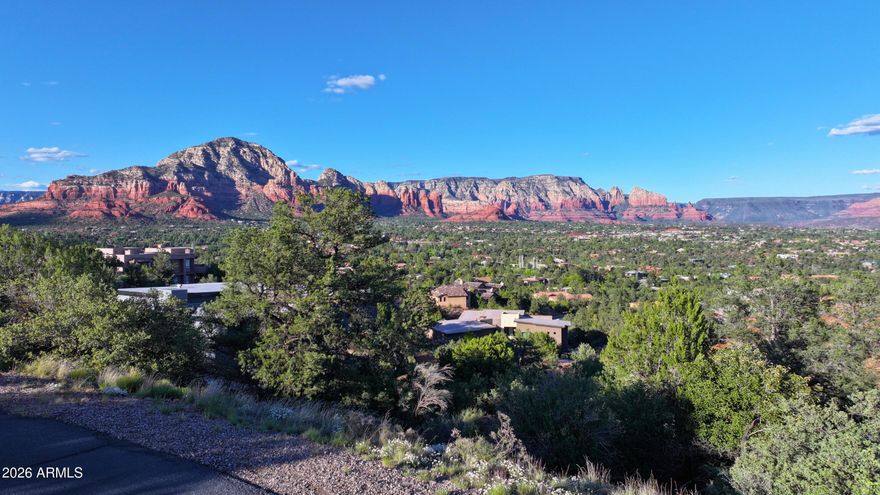 Perched atop the coveted drive ''Calle Del Montana'' in prestigious, gated Foothills South, one of Sedona's most exclusive communities, this rare custom homesite offers sweeping, unobstructed red rock views. From this elevated vantage point, the panoramic views create a daily backdrop you simply can't replicate anywhere else.

Set in the heart of West Sedona, you get the best of both worlds: quiet, secure living inside a luxury enclave, with trailheads, shopping, dining, golfing and galleries just minutes away. The SEWER ASSESSMENT HAS BEEN PAID, removing a major upfront cost and simplifying your build. Design your dream home, capturing sunrise and sunset from your main living areas, expansive patios, and future pool or spa. 

Premium view lots in Foothills South are limited, and true view parcels like this are exceptionally rare. Come see the property, take in the majestic Sedona landscape, and you'll immediately understand why this lot is so special.