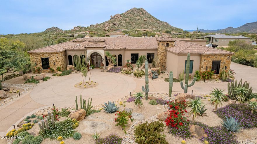 WOW! LOOK AT THE COMPS! This is a BARGAIN, almost 7000 sq ft, 1 acre lot in prime Scottsdale location!  Car collector's dream, every day living here is like being at a 5 star resort! This gorgeous 5 bed, 6.5 bath estate has it all!  Some of the many featues include:  large bedrooms with en suites and built in closets, all windows have motorized blinds, speakers throughout,  large game & home theater room, 16ft ceilings, Chef's kitchen w/60'' Wolf range, 2 sinks, 2 dishwashers, bar with sink.  There is a huge pool, water features, fire bowls, over 1000 sq ft of patio space, misting system, out door bathroom w/shower, amazing mountain views and gorgeous greenery!  ''Climate controlled'' garage with epoxy floors, 11 ft doors and 16 ft ceilings  for car lifts. NO HOA.  Check out the video! WOW The seller has provided a special message below concerning what she and her family have loved so much with living at this gorgeous estate:

"There are so many amazing elements to this estate, that it is hard to pinpoint just a few reasons as to why this home is so incredible to live in. Everyday that I pull into the driveway of this property, I have such a feeling of the pride of ownership getting to call this beautiful home mine. The house itself looks palatial and like something out of a magazine. The beautiful landscaping of cactus, agaves, and bright colored flowers, is inviting and so beautiful to look at on a daily basis. The property itself feels like a compound with no architecture like it around. The outside of the house looks like a piece of art. Once I pull inside the garage, the amount of space and room for all of my vehicles makes me feel like I am in a museum. It is incredible how much room there is and how well thought out the storage was for the space.

Stepping inside, one of the many things I love about our home is the level of privacy and space it offers, which is becoming harder and harder to find in Scottsdale. We're on a generously sized lot with wide open areas where the kids can run, play, and explore without feeling boxed in. There's plenty of room for outdoor games, sports, and family get-togethers, and the layout of the property gives us a true sense of seclusion. We can enjoy our backyard without feeling like neighbors are on top of us, which makes everyday living feel more peaceful and more luxurious.

Our backyard is truly one of a kind, centered around a massive resort-style swimming pool with a slide that feels more like a private retreat than a typical backyard. It's perfect for pool parties, weekend barbecues, or just unwinding after a long day. The kids can spend hours swimming and playing, and there's always space for adults to relax and enjoy the setting. The scale of the pool and outdoor area makes it easy to host friends and family without ever feeling crowded, and it's honestly one of our favorite parts of the home. The misters are cool the backyard on hot summer days and allow the yard to be used year round. With younger kids, the outdoor bathroom and shower make play time so effortless and truly make you feel like you are at a resort, especially with the mountain views.

Inside, the home is just as impressive with large, open rooms and incredibly tall ceilings that you rarely see anymore. The ceilings make the entire house feel even more open, bright, and unique, and they give every space a sense of character and grandeur. The natural light, combined with the scale of the rooms, creates an atmosphere that feels both comfortable and elevated. It's a home that feels custom, spacious, and special the moment you walk inand that's something we appreciate every single day. There is no greater feeling of enjoyment than opening the massive sliding doors and being able to spend time in the indoor-outdoor environment that this home creates.

With a hectic lifestyle, this home provides a true space to relax in at the end of busy day. The floor layout allows for privacy from the kids, but also keeps them close. The two dishwashers and multiple prepping surfaces in the kitchen are every mother's dream.  The massive laundry room makes laundry a breeze. And, the master bedroom and bathroom are like something out of a Hollywood movie, making me never want to leave.

This home is a true piece of art and has so many special things about it, that the only way to really understand its grandeur is to come see it in person."

Recent seller improvements as follows:  

- All new irrigation for the front and back yards
- All new landscape lighting in the front and back yards
- Installed grading/drainage along front of house
- Installed backyard ficus plant hedge
- Install new grass in backyard and new artificial turf for side yard dog run
- Installed new rip rap and decomposed granite in front yard
- Installed cacti specimen plants, trees, and flowering plants in front yard



Well over $100,000 in improvements done to the exterior.