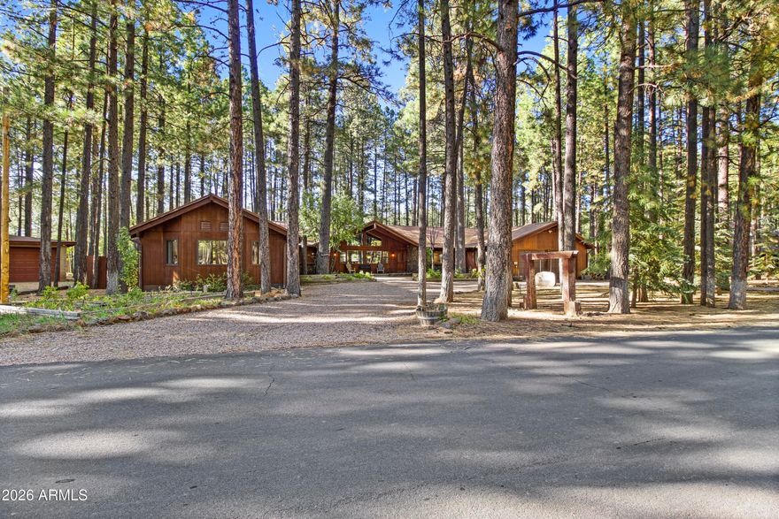 Beautiful REMODELED Ranch on the 17th Fairway of Pinetop Country Club.This 5 bedroom, 4 Beth home offers views of the fairway from your covered patio or hot tub.  Recently Remodeled in 2024, new flooring, walnut cabinets, kitchen has quartzite stone counters, builtin microwave with oven, air fryer, etc., LVP throughout home.  Energy efficient windows on the golf course side of home.  Separate Guest Qtrs with separate entrance.  Guest Qtrs feature large great room, large bedroom with King bed and bunk beds, bathroom and kitchenette with mini split for heat and A/C. Main house has vaulted T&G ceiling in Great room and master bedroom, split floorpan, 2 wood fireplaces, new showers, 2 laundry rooms, and a large 2 car garage. Beautiful views in the cool mountain air.