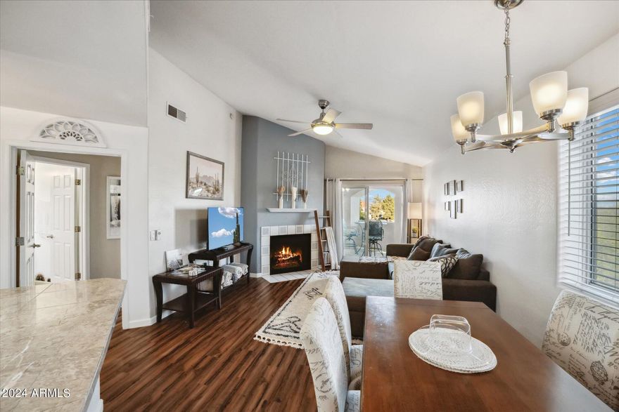 Rare opportunity to own a fully furnished turn key asset! This second floor end unit sits in the highly sought after Paradise Valley subdivision of Marbeya! Whether you are looking for your new home or home away from home this cozy 2 bed 2 bath condo is sure to please. Step into the tranquility of this centralized end unit and be amazed at the soaring vaulted ceilings, wood burning fireplace, custom color palette, granite counters, SS appliances, and wood floors. The kitchen and common area is a chef and entertainers delight. The floor pan is ideal with bedrooms on opposite ends of the unit and storage in all the right places. Both bedrooms are equipped with large walk in closets and the master boasts an en suite! The patio is equipped with laundry and looks over the Indian Bend wash.
