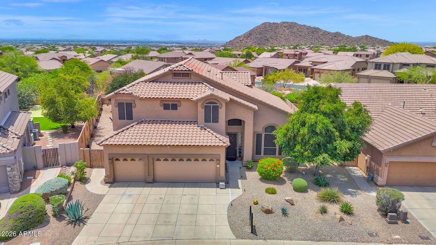 Move-in ready and beautifully prepared. This sought-after floor plan has been meticulously maintained and thoughtfully upgraded to impress even the most discerning buyer. Situated on an oversized yet private lot, this home offers room to relax, entertain, and grow. Enjoy summer days by the pool, gather beneath mature shade trees, or take in Arizona sunsets around the firepit. Inside, you'll find light, bright living spaces, neutral finishes, stylish selections, and brand-new carpet. A full bedroom and bathroom downstairs provide ideal space for guests, multigenerational living, or entertaining family and friends. Upstairs, the 5th bedroom is currently open to the primary suite, creating a perfect office, sitting room, nursery, or private retreat--with the option to enclose it with one wall for a true 5th bedroom. Located in a desirable golf community with A+ amenities, Grade-A schools, hiking and biking trails, pickleball, pools, parks, and year-round recreation. Just minutes from Scottsdale, Sky Harbor, and Falcon Field--this home delivers lifestyle, location, and comfort all in one.