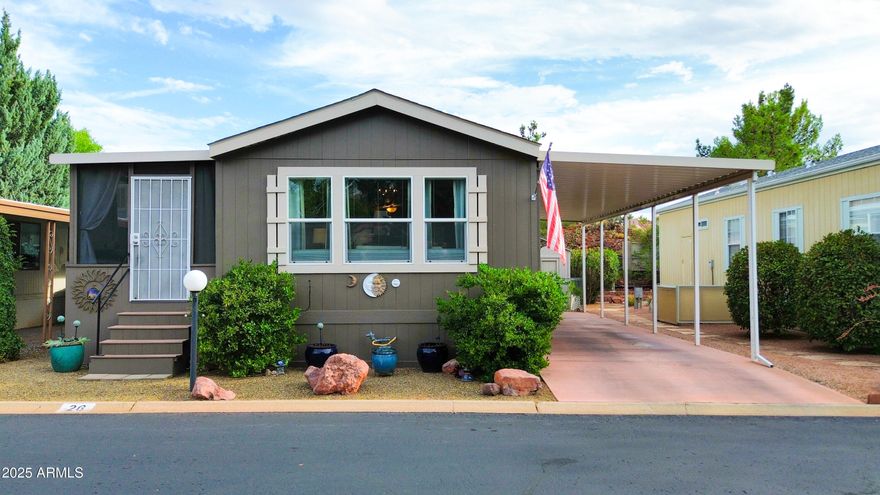Peaceful Sanctuary w/ Gorgeous Red Rock Views! This Beautifully Maintained 2 Bedroom Cavco Home w/ Fully Renovated Workshop Located in a Tranquil 55+ Community in the Heart of West Sedona Features: AZ Room. Lovely Open Floorplan. Vinyl Plank Floors. Carport. Workshop w/ Electricity, Walls, Flooring, Paint, Ceiling Fan. Private Fully Fenced Backyard w/Grass. Some of the Home Improvements Include: Neutral Paint Colors, New Fixtures, New Flooring, New Kitchen Sink Faucets, New Porch Painted & Screened-in incls patio rugs. New Landscape throughout entire Backyard. *Buyer has the option to buy furnishings through separate bill of sale. Sunset Village offers a community pool & clubhouse & is centrally located just minutes from shopping, theaters & parks! Must see!