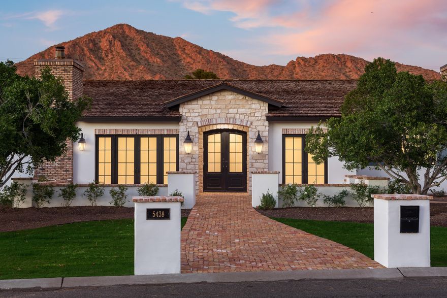 Incredible opportunity. Almost completed. Candelaria Designed home sitting on almost an acre. Seller built this home with the highest level of materials to live in but decided not to move to Arizona. This is a rare opportunity. Enjoy Camelback Mountain views from just about every room within the home. Large gourmet kitchen showcasing a Wolf range opens up to the family room. Pocket doors leading out to the spacious backyard. Every bedroom has a walk in closet and its own bathroom. Large master retreat with two walk in closets. Fabulous office with fireplace featuring french doors leading out to the front courtyard.  This home also offers two large air conditioned storage spaces that can easily add additional square footage making this home even more grand.