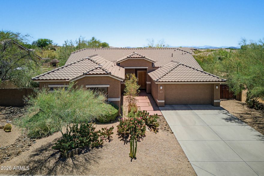 Beautifully maintained home in the desirable gated community of Colina Del Norte! This spacious 4 bedroom, 2-bath split floor plan features tall ceilings, open concept, and a versatile den currently used as an office. The expansive kitchen offers a gas stove, breakfast bar island, and opens seamlessly to the Great Room. Numerous windows showcase the resort-style backyard complete with a refreshing pool and waterfall, covered patio, fire pit, beautiful desert landscaping, and view fencing. Enjoy added privacy as the backyard backs to preserved open space on two of its three sides. Additional highlights include a 2-car garage with a 4-foot extension for extra storage, TWO new A/C units July 2022, New Roof Underlayment in 2023, new hot water heater, pool filters and irrigation.