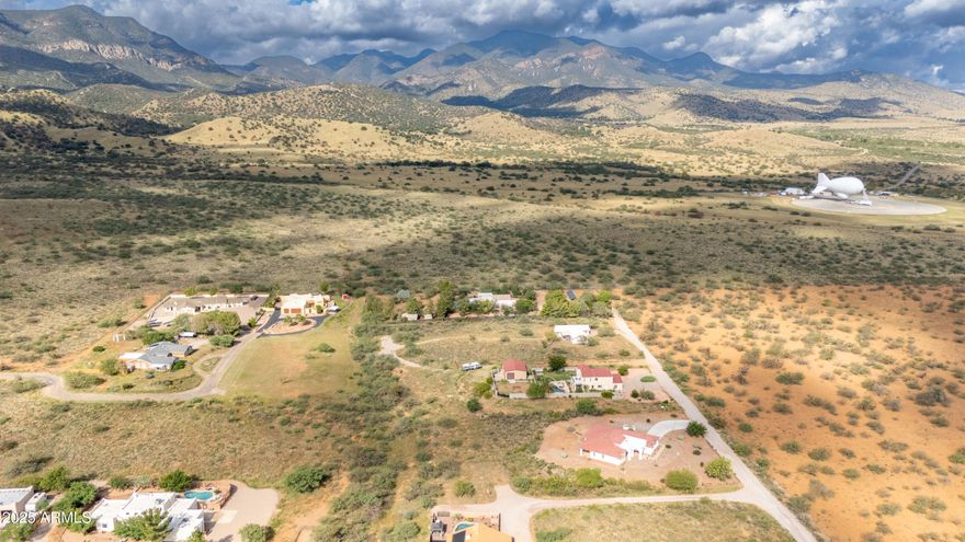 Build your dream home on this 1.004-acre lot with stunning mountain views at the base of the Coronado Mountains. Very close to national forestry land, enjoy abundant wildlife and natural beauty. Utilities are ready with power, water through Liberty Utilities, and cable at Yaqui St. A recent survey with re-pinned corners and topographic details is complete, plus a perc test has been done (alternative septic required). The lot is partially fenced on three sides and located near the Aerostat landing pad. With no HOA restrictions, you'll enjoy freedom and flexibility to create the property you've always envisioned. Whether you're looking for a peaceful getaway or a permanent residence surrounded by stunning desert scenery, this land is ready to bring your vision to life.