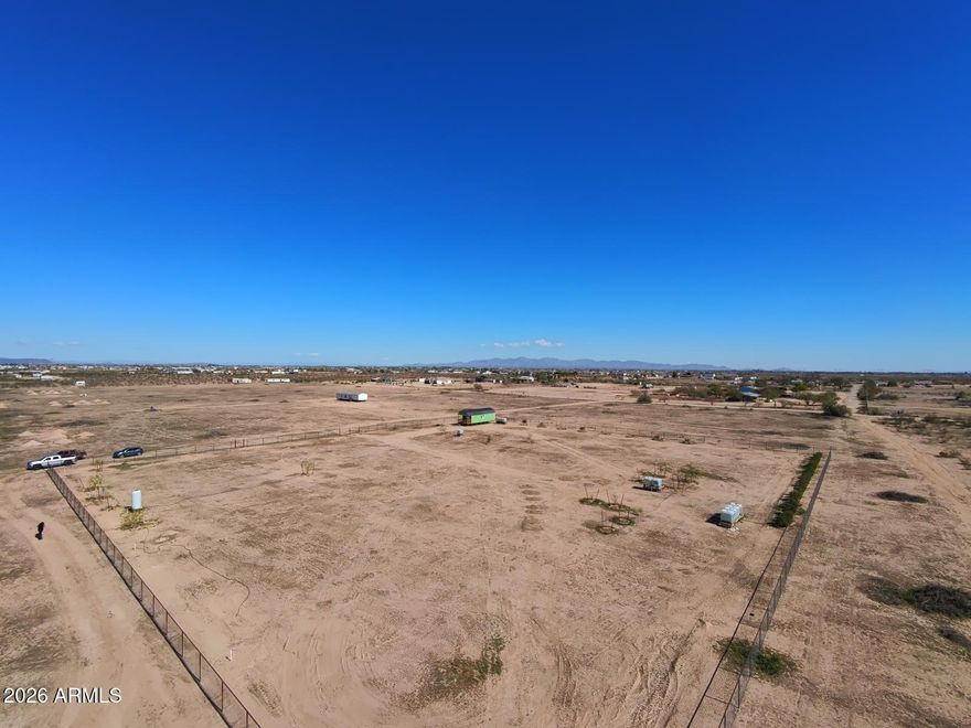 Unique opportunity to own a beautifully improved parcel in Tonopah near Salome Hwy! This fully gated property offers privacy, functionality, and established landscaping rarely found in desert land. Featuring mature shade trees, fruit trees, and oleanders, the property provides a lush setting with a self-installed drip irrigation system already in place — a valuable head start for anyone looking to build or expand.
Zoned R-43 , this parcel allows for custom homes, manufactured homes, horses, and additional structures, giving you flexibility for residential, agricultural, or hobby farm use. The level terrain and usable layout make it ideal for future development while enjoying the benefits of existing improvements. Seller will carry with $50,000 down