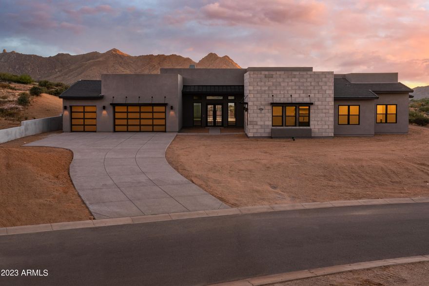 Stunning Move-In Ready home now offered at Ranch Gate Estates! This Beautiful Floor Plan w/ Award Winning Contemporary Design can be yours at Ranch Gate Estates in North Scottsdale. Mountain Views surround this lovely lot which can be Landscaped to your liking. Nestled under the stars, this home features magnificent Sliding Doors that open the home to the outdoors from the Great Room and Interior Courtyard, overflowing with natural light! The Gourmet Kitchen appointed with Wolf Appliances is perfect for entertaining below 14 ft dramatic ceilings! This gorgeous Home Site offers oceans of views of Troon Mountain and Tom's Thumb under pristine Sonoran Desert as far as you can see, and Toll Green Energy efficiency at its finest!