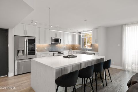 Photo of 6502 N Central Avenue #A103, Phoenix, AZ 85012 (MLS # 6962278)