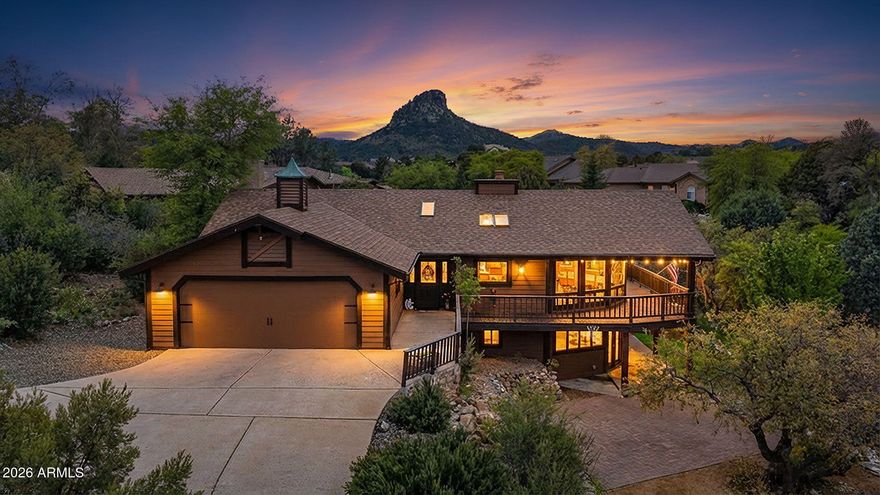 If you've been dreaming of captivating views and easy single-level living--this is it. Tucked into the highly desirable Forest Trails, this 4-bedroom home delivers stunning, panoramic forest and Granite Mountain views from nearly every angle. Step inside and you're welcomed by warm wood tones, a statement brick fireplace, and walls of beautiful new windows that pull the outdoors in. The remodeled kitchen shines with GE Café appliances including a 2-drawer dishwasher and a counter depth fridge then flows effortlessly to a wraparound deck made for morning coffee or sunset unwinding. Downstairs, a full walk-out in-law suite, complete with kitchenette, offers incredible flexibility with its own private entrance, patio, and parking--perfect for guests, multi-gen living, or added privacy....... With thoughtful upgrades, no-step access, and just minutes to downtown Prescott, this home blends comfort, beauty, and lifestyle in all the right ways. Additional highlights include an oversized 2-car garage with workshop space, tankless water heater (2020), roof (2015), HVAC (2011), and whole-home humidifier. Located just 10 minutes from downtown Prescott, shopping, and healthcare. The main level features easy, handicap-accessible living with no floor transitions.