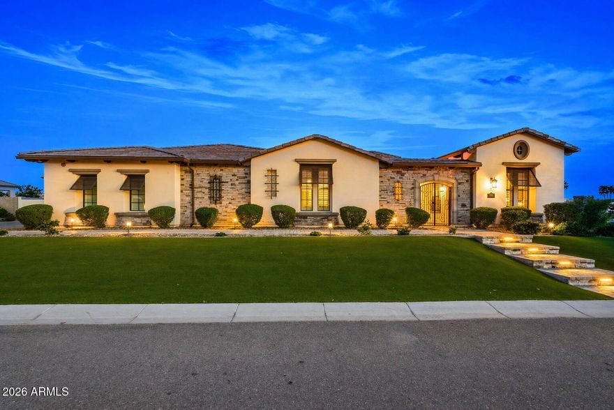**2.25 ASSUMABLE LOAN** Located in the gated Estates at Mandarin Grove--an intimate community of just 11 custom homes--this beautifully designed residence sits on a spacious corner lot and offers the perfect balance of comfort, style, and functionality. The home features 5 ensuite bedrooms, including an attached casita with its own private entrance, ideal for guests or multi-generational living.

A gated front courtyard creates a welcoming sense of privacy. Inside, wood-look tile flooring and thoughtful upgrades add warmth and character throughout. The kitchen is equipped with high-end Wolf and Sub-Zero appliances, a large walk-in pantry, and opens seamlessly to the main living space. A custom fireplace, upgraded sliding glass doors, and electronic shades in the living area create an effortless indoor-outdoor feel.

The southern exposure backyard is built for entertaining, with a pebble-finish pool, Baja shelf, tiered water feature, lighting, travertine, expansive turf, built-in BBQ, and a covered patio.

Car enthusiasts and hobbyist will love the 20x50 RV garage with 16-foot ceilings, epoxy floors, air conditioning, half bath, industrial fan, and dual sinks, along with a 4-car garage with its own mini-split system. Radiant barriers in both the home and RV garage help improve energy efficiency and temperature control. The primary suite offers a spacious walk-in closet and a spa-style shower.

A standout opportunity in one of Mesa's most desirable gated communities.