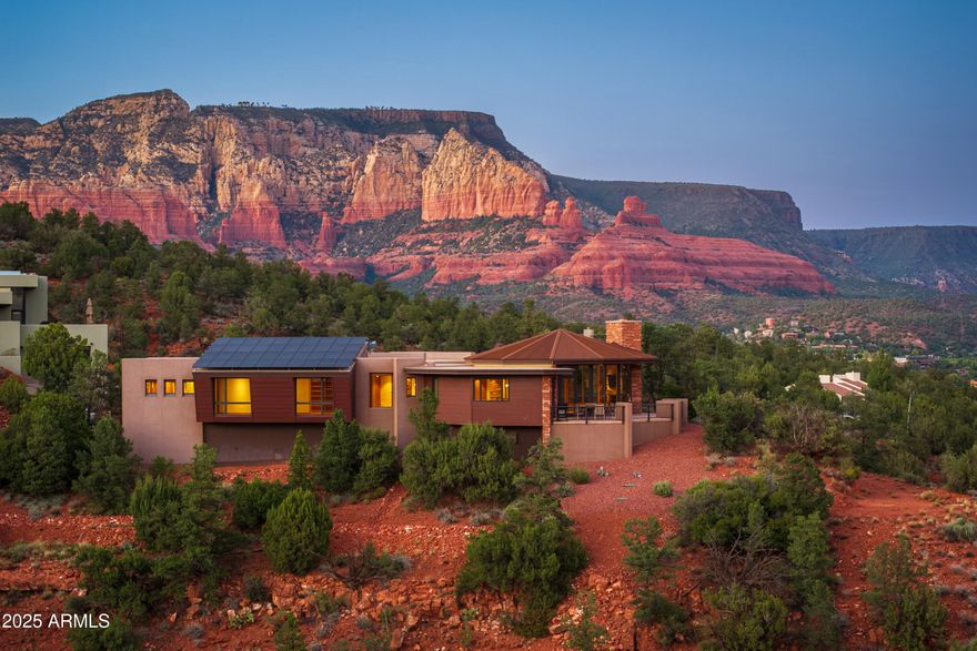 Don't let this dream slip away...grab your chance to own a jaw-dropping 2022 masterpiece by the legendary Design Group, brought to life by Sedona's acclaimed builder, Joel DeTar! Perched like royalty on a 1.29-acre hilltop throne with only 3 other homes, this masterpiece delivers nearly 360-degree epic RED ROCK views that'll steal your breath and your heart. This is your ticket to Sedona's ultimate ''pinch-me'' lifestyle! This home flaunts panoramic vistas from a wraparound deck, perfect for sunset sips or morning coffee with the Red Rocks. Lock in those views forever with the adjacent .87-acre lot (offered separately with buyer's first right of refusal). This 3,466 sq ft single-level, nearly new gem offers cutting-edge design, modern efficiency, and views that scream ''you've arrived''! LOT INCLUDED IN SALES PRICE (VALUE: $150,000). 

Don't Miss The 3-D Tour & Floor Plan Available! Photos with furniture are virtually staged with furniture.

Luxury That Wows: With 3 bedrooms, 3.5 bathrooms, this home is designed to impress. Revel in radiant in-floor heating, a stained glass overlay on the primary bedroom's door, and slick electric blinds throughout.

Gourmet Kitchen Goals: Cook like a pro with a Sub-Zero refrigerator, wine refrigerator (yours with the sale!), ultra-quiet Bosch dishwasher, electric cooktop and stove, and instant hot water for those cozy Sedona nights.

Eco-Smart & Wallet-Friendly: Rock owned solar panels on a slanted roof for major savings, plus an owned propane tank. Charge your EV with ease using the 50-amp service in the garage (charging station not included).

Pure Bliss Amenities: Dive into relaxation with the above-ground swim spa and sleep soundly knowing the fire suppression system in has your back. 

Your Hilltop Kingdom Awaits: With only 4 homes on this exclusive hilltop, you'll feel like Sedona royalty. Deed restrictions (no short-term rentals, 30-day minimum) keep the peace. Check MLS documents for details. Forget outdated remodels with aging roofs and appliances; this nearly new gem offers cutting-edge design and modern efficiency, at an unmatched price.

820 Laurel Spur isn't just a dream, it's your Sedona fairytale come true. Don't wait to claim your crown and live the dream!

Details:
- Wraparound view deck
- Sub-Zero, Bosch & wine refrigerator
- Den/optional 4th bedroom
- Owned propane tank
- Instant hot water
- 50 AMP EV garage outlet
- Electric blinds
- Above-ground swim spa
- Adjacent .87-acre lot may be purchased separately (Parcel:401-56-021). Buyer has first right of refusal to purchase adjacent lot
- Unmatched privacy, stunning sunsets, and just minutes from West Sedona

960 Laurel Spur (Adjacent Lot): Parcel - 401-56-021 (Lot 23) shall be sold with property on separate purchase contract - with first right of refusal to buyer. Seller paid $350,000 for lot. Offer of consideration on price of lot shall be determined with the purchase of residence (Lot 24: 820 Laurel Spur).