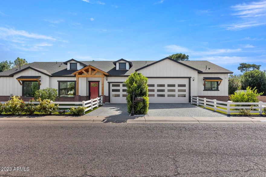 Exquisite New Home w/high end finishes, Smart Technology! Minutes away from Old Town Scottsdale.  Niche area-1/2 acre lot & NO HOA.   Built to be their Forever Home the breathtaking attention to detail is unsurpassed.  14' Ceilings & Glass walls encompassing the covered patio & facing the massive back flood irrigated lawn is complete with a Pickle Ball Court!  Acoustic wall paper, central vac, state of the art Automation/Security/Audio including 88 speakers and 19 cameras, Hydraulic auto TV mounts & motorized blinds. Waterfall counters.  Electric car charging station. Attached 2/2 Guest Quarters with private entrance, kitchen, laundry & garage.  Property boasts lemon, orange, lime, grapefruit and tangelo trees.  Serene, secluded silence at this location..Your Dream Home is waiting for you