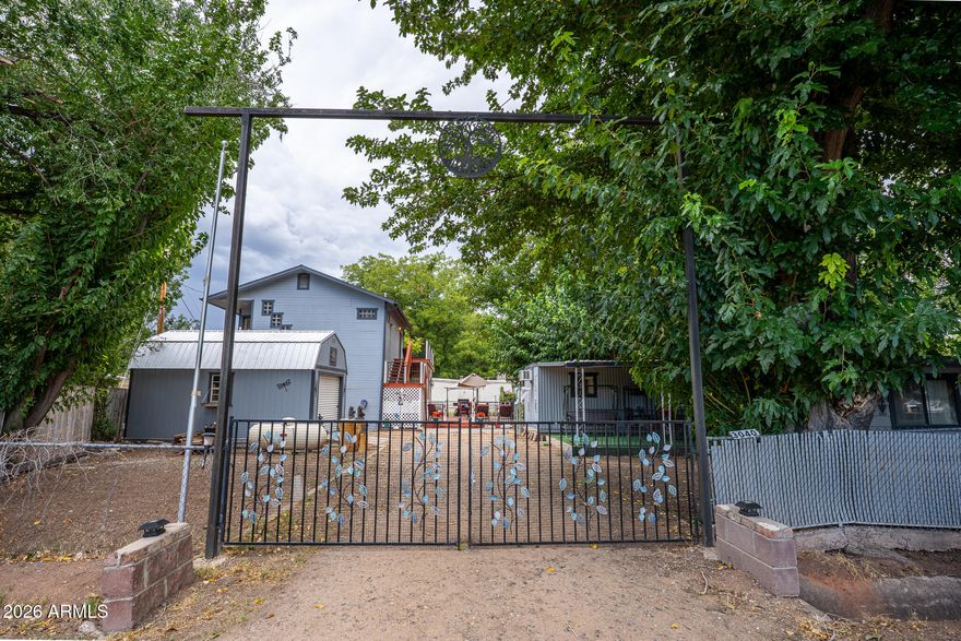 Discover this rare find featuring two separate homes on a single lot enclosed with a perimeter fence. Perfect for multi-generational families or investors looking for rental income. The charming two-story site built home is designed for comfort. The Upper level is dedicated entirely to the spacious Master Suite, featuring a private master bath and French doors  open up to a wrap-around-deck.  Downstairs is built with a formal dining room a full kitchen and a guest bathroom. A large wooden deck extends the living space outdoors, ideal for entertaining. 
Both are connected to same Well, Septic System and Electric.. Priced as per Appraisal. 
Property is being sold in its present  condition. Furnishings are available outside of Escrow. Manufactured has a different address. The Manufactured Home has a separate address: 3040 N Verde River Dr.  Parcel# 403-18-005, Taxes Billed for 2025-$408.00.