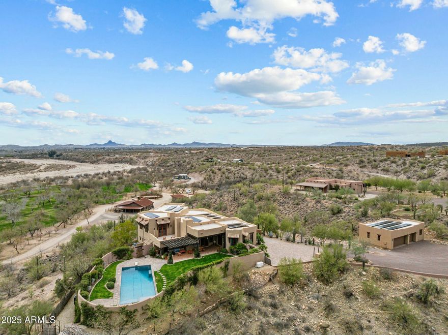Premium Equestrian Estate!  Stunning Territorial/Santa Fe Home designed by Chaves & Associates.  Sitting on 35 acres overlooking the Hassayampa River in stunning desert surrounded with killer views. Primary home offers just under 4000 square feet of Western décor living space, 3 bedrooms plus a den or 4th bedroom. 4 full baths. Primary suite split floor plan.  Large open floor plan with a gourmet kitchen with Granite countertops, custom made cabinetry, and breakfast bar. 3-car garage with workshop. There's a heated pool and above ground hot tub. Property includes an 1100 square foot 2-bed 1-bath casita with 2-car garage, plus RV garage and two vehicle carport.  Approximately 10 acres of divided, fenced  irrigated pastures, with plenty of mature mesquite trees for wonderful shade. There's an excellent 4-stall mare motel that can be divided to make 8 stalls, and a round pen. There's a barn with 4 stalls, turnouts and a wide breeze way, a complete apartment and plenty of storage. There's a large tack room with wash bay and a large, covered porch There's an equipment barn, hay barn, two sealed sea-crates for grain storage. Caretakers housing is 1-year-old 1500 square foot double wide modular home.
 Property is in Grantham Ranch, a premier equine community. After entering the coded security gate at the entrance, you will travel approximately 2 miles on a country road to the end of Tellier Trail. You then arrive at a very private and quiet rancho that feels to be way in the country but surprisingly is only a 10-minute drive to downtown Wickenburg. 35 miles of beautiful riding trails right from your backyard, this is a perfect, must see, for anyone loving the equestrian life in Wickenburg's thriving horsemen's world.