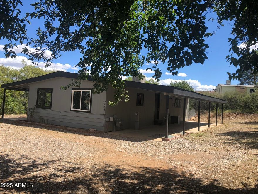 Own your own land on this spacious quarter-acre lot filled with mature trees and outdoor living spaces. Enjoy two covered porches, a covered parking area, and NO LAND LEASE--a rare find that adds long-term value and peace of mind.
Inside, you'll find 3 bedrooms plus 2 bonus rooms, offering flexible space for hobbies, guests, or a home office. The property also includes a separate detached space with AC, perfect for an art studio, workshop, storage, or whatever you imagine.
Recent upgrades include a new high-efficiency gas heating system and an asphalt shingle roof less than two years old. The kitchen features newer cabinets and appliances, making it move-in ready.
Financing may be available with as little as 5% down.