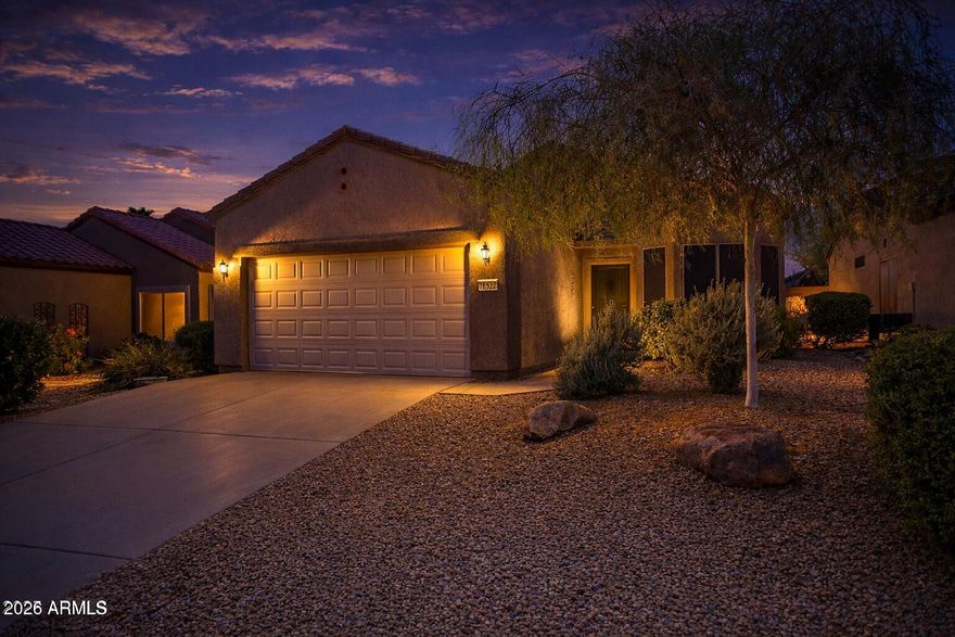 One of the best private lots paired with one of Sun City Grand's most sought-after floor plans! This 2-bed, 2-bath home with a double garage delivers comfort, easy living, and the vibrant lifestyle The Grand is known for.

Inside, the open layout welcomes you with plantation shutters and a bright kitchen offering ample cabinetry and a charming breakfast nook. The spacious primary suite features a bay window bump-out and a generous walk-in closet, while the guest bedroom is perfect for visitors or a hobby space.

Step outside to one of the most peaceful backyards in The Grand, complete with an extended covered patio--perfect for relaxing and enjoying Arizona evenings.

Residents enjoy access to four championship golf courses, two fitness centers, a spa, pools, tennis and pickleball co