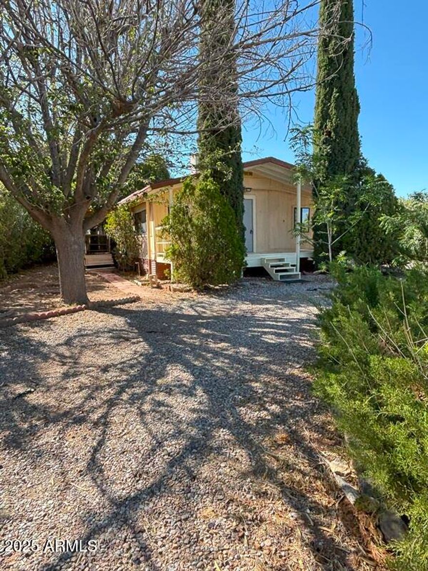 3 Bedroom 2 Bath double wide trailer in Golden Acres trailer park.  Has a U shaped driveway in front of the home for easy in / out, plus a gated car port. Tool shed, new windows, carport, ceiling fans, evaporative cooler. Golden Acres park does not have a land lease.  The HOA provides garbage service.