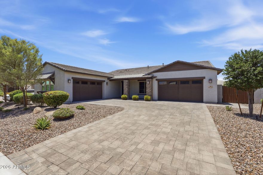 Stunning, move in ready, 4 bedroom, 3.5 bath home in the community of Waterston! Home features open concept living on a premium lot (no neighbors behind) with a built in BBQ, pergola, fire pit, turf and double gate. This 5-CAR garage home features a split floor plan with spacious great room, gourmet kitchen with massive quartz island, gas cook top, stainless appliances including refrigerator, walk in pantry, and extended buffet. Home has an open den and formal dining area. Primary suite features double closets, dual sinks, walk in shower and large soaking tub. There is an ensuite with a walk in closet and large bathroom. Perfect for multi generational living.  Waterston community has a resort style community pool, clubhouse, numerous parks and lakes! This is a must see