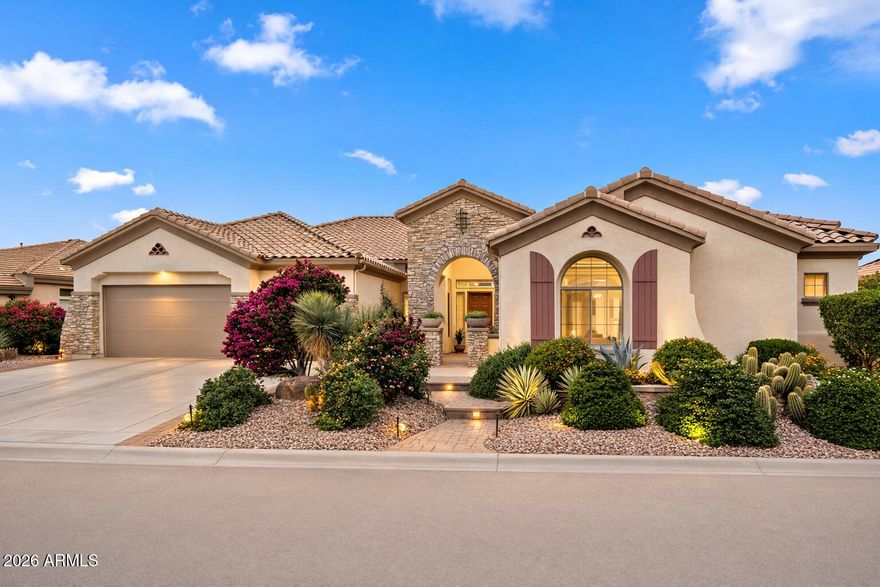 Live the Anthem Country Club lifestyle just moments from the clubhouse and golf in this beautifully designed home built for effortless indoor-outdoor living. The resort-style backyard is ideal for relaxing and entertaining, featuring a heated pool and spa with a tranquil waterfall, an expansive 1,000+ sq ft paver patio, built-in BBQ, outdoor gas fire pit, and an adobe wood-burning fireplace, perfect for evenings under the Arizona sky. A charming garden area adds to the peaceful outdoor setting, while the backyard layout offers an ideal setting for pet lovers with space for a future dog run, turf lounge area, or expanded entertaining.

Inside, soaring ceilings create a bright and open feel throughout. The spacious kitchen is designed for gathering and entertaining with slab granite counters, a large island with bar seating, 5 burner gas cooktop, double ovens, high-end refrigerator, butler's pantry, an enormous walk-in pantry, and extensive serving and storage space.

The primary suite, located on the main level, serves as a private retreat with dual vanities, his and hers walk-in closets, tall windows that fill the space with natural light, and direct access to the backyard patio.

Two dedicated main-level offices provide excellent privacy and flexibility, making this home ideal for working from home or quiet productivity.

Additional highlights include a rare 4-car garage, a highly sought-after feature in Anthem, plus a large driveway accommodating at least 3 more vehicles for parking convenience.

The home has been freshly updated with new interior and exterior paint, new wood flooring throughout, and new granite countertops in the bathrooms, creating a pristine, move-in ready home for the new owner.

Located within Anthem Country Club, a private, guard-gated community offering 36 holes of championship golf, tennis and pickleball courts, two fitness centers, pools, clubhouses with dining, plus additional amenities including steam sauna, dry sauna, and massage rooms. Residents enjoy a true resort-style lifestyle with a vibrant year-round social calendar. Also close to TSMC, USAA, and major employment centers along with shopping, dining, and outdoor activities.

This is a community where neighbors become friends and every day feels like a getaway.