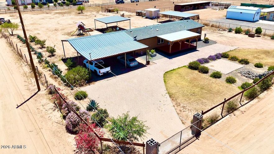 NO HOA HORSE PROPERTY in a fast growing area! This beautifully updated 1.24-acre property offers endless potential and plenty of room to spread out. The home features 4 bedrooms and 2 bathrooms with a spacious living and dining area, tile flooring in the main areas, carpet in the bedrooms, neutral paint throughout, and vaulted ceilings and skylights that give it a light, open feel. Did we mention all of the SPACE? 1.24 ACRES!!! Plenty of covered parking, 3 rolling RV Gates all on a corner lot to fit all of your needs!! Now is the time to take advantage of these prices before rates drop and prices go back up!! Easy comp is the neighbor to the West who just sold for more than our asking price with less upgrades!