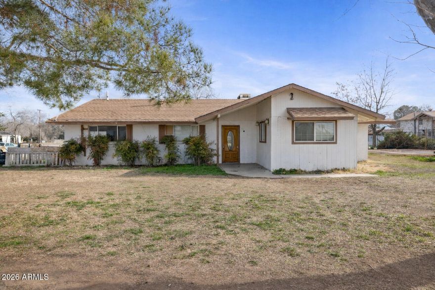 Rare multigenerational property on 2.63 acres of Commercial land in the heart of Chino Valley. This unique residential estate offers space, privacy, and versatility rarely found in today's market. The main home features a comfortable 4-bedroom, 2-bath layout, ideal for everyday living. A separate 2-bedroom, 1-bath guest house provides excellent accommodations for extended family, guests, or potential rental income. Adding even more flexibility is a 1-bedroom, 1-bath apartment situated above a large garage/workshop, perfect for adult children, caretakers, or private living quarters. The property also features a small pool, offering a great place to cool off and relax during warm Arizona days. Serviced by a private well and septic, the property provides independence and long-term utility savings. With ample space for multiple households while still maintaining privacy, this home is ideal for multigenerational living or buyers seeking a unique residential setup in a central Chino Valley location. A truly special opportunity with endless residential possibilities.