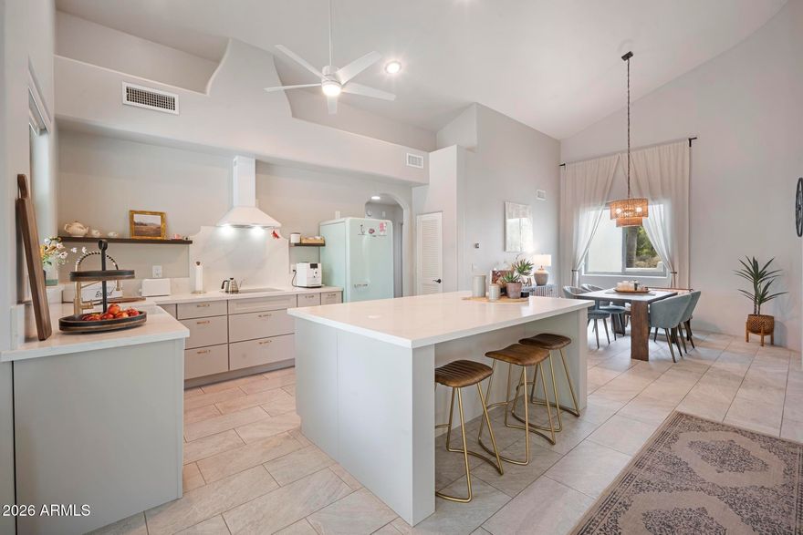 Completely remodeled Cave Creek gem with no detail overlooked! Soaring vaulted ceilings and custom tile flooring flow throughout the open, split floor plan. The chef's kitchen is complete with all-new custom cabinetry, quartz countertops, and an induction cooktop. Bathrooms are equally impressive with Riverdale White tile showers and quartz countertops-high-end finishes at every turn. Major ticket items are done: brand new roof, new windows and back door, updated electrical, fresh stucco exterior with a lifetime warranty, and interior paint. Outside, enjoy your PebbleTec pool, two 200 sq ft storage sheds, and a rooftop deck with breathtaking mountain views and unforgettable Arizona sunsets. The expansive lot offers endless potential -- bring your horses, build a guest house, add an RV garage, or all of the above. On a paved road with a 2-car garage and access to miles of trails just down the street for riding and hiking. This one checks every box!