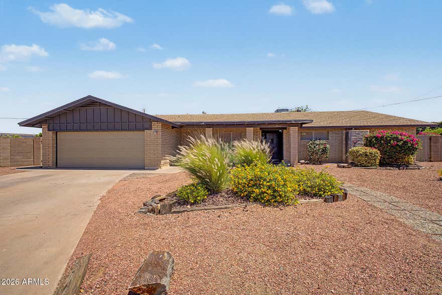 Bring your vision to this well-located home in the heart of Paradise Valley Village, one of Phoenix's most desirable and established neighborhoods. Incredible opportunity to own a 5 bed 2.5 bath home on a HUGE lot with Mountain Views.  Tile and wood floors throughout no carpet! Spacious Kitchen opens to family room with gas fireplace.  Pool out back has been drained and pool equipment disconnected, with a new pool this backyard could be a Beautiful Oasis!! Newer Roof 2013,  Newer AC 2013.