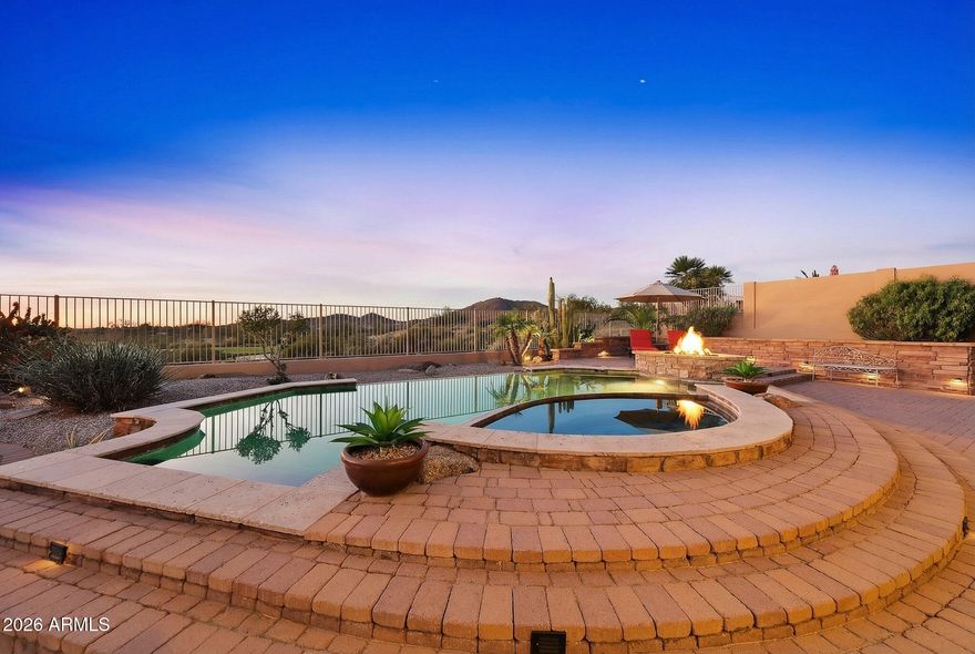 NEW HVAC's INSTALLED MAY 2026! Experience one of the best values on the golf course in the gated subdivision of The Fairways within the master planned community of Estrella.
Perfectly positioned on the third tee box, this lot has sweeping golf course and mountain views.  From the sparkling pool and fire pit to the inviting courtyard with a fireplace, every space is designed to enjoy Arizona's year-round living.
Inside, you'll find a spacious and functional layout with generous living areas, high ceilings, and abundant natural light.
For buyers looking for amazing mountain and golf course views, this is it! This property offers the perfect combination of location, lot, and value!
Located in the master planned community of Estrella where its more than just owning a beautiful home e - it's embracing a vibrant lifestyle. Residents enjoy two private clubs, resort-style pools, state-of-the-art fitness centers, scenic hiking and biking trails, serene lakes, year-round community events - all surrounded by the stunning beauty of the Sonoran Desert.
This is more than a home on the golf course. It's a daily vacation, a gathering place, and a front-row seat to Arizona's most breathtaking sunsets.