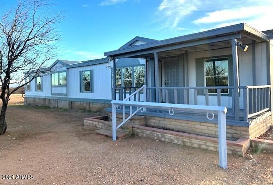 Check out this AMAZING 4 bedroom/2 bath 2,128 sq ft home on 4 acres with a NEW roof, NEW paint and like-NEW flooring! The master suite boasts a large bedroom, walk-in closet AND an additional room that could be used as an office, sitting room, game room, or ??? The master bathroom has a separate shower and garden tub, double sinks and lots of storage. Enjoy the cool comfort of this beautiful home as you whip up a special meal in the efficient, roomy kitchen or step out onto the back deck to entertain and enjoy the majestic mountain views. This home has storage room for all those extra items and there is plenty of acreage for whatever your outdoor needs might be! Call for a private tour today and see if this is the HOME for YOU!