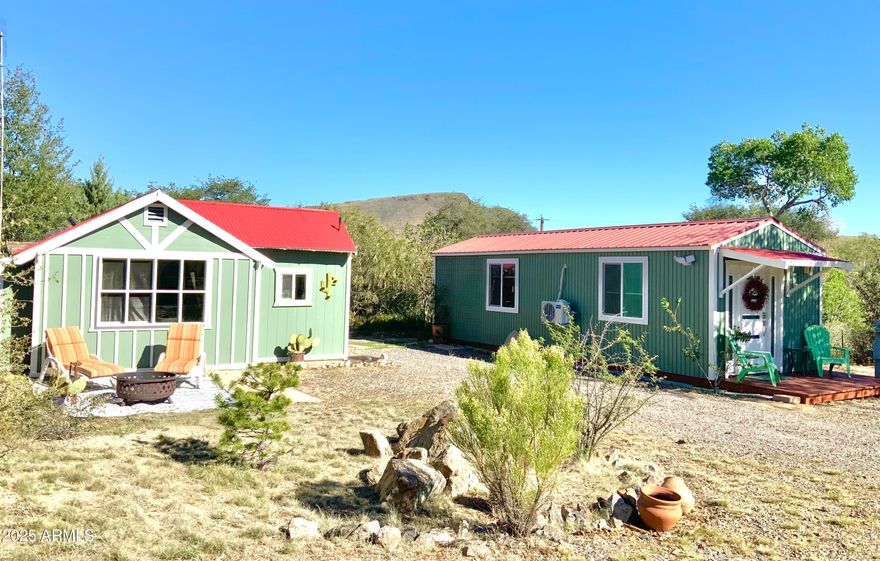 Unique double cottage living in the quaint town of Yarnell. Newly renovated bungalows, each has 1 bedroom, 1 bath. A great set-up for mother-in-law quarters, private office, art studio, or Airbnb rental complete with RV hook-up. Fabulous mountain views from spacious deck w/outdoor bar & solarium. Located on a quiet road with new perimeter fencing, entry gate & nice shed behind property. Parcel #203-03-060 is adjacent and available to purchase if you are looking to live close while you build larger home and have future rental income property.